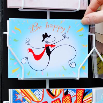 Postcard of the short film Avant Card in a postcard stand