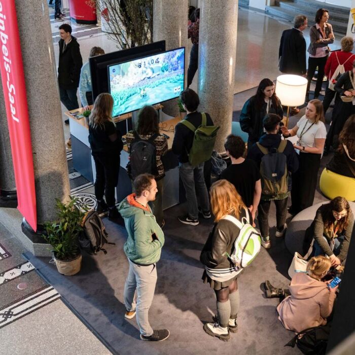 People standing at a booth at a convention