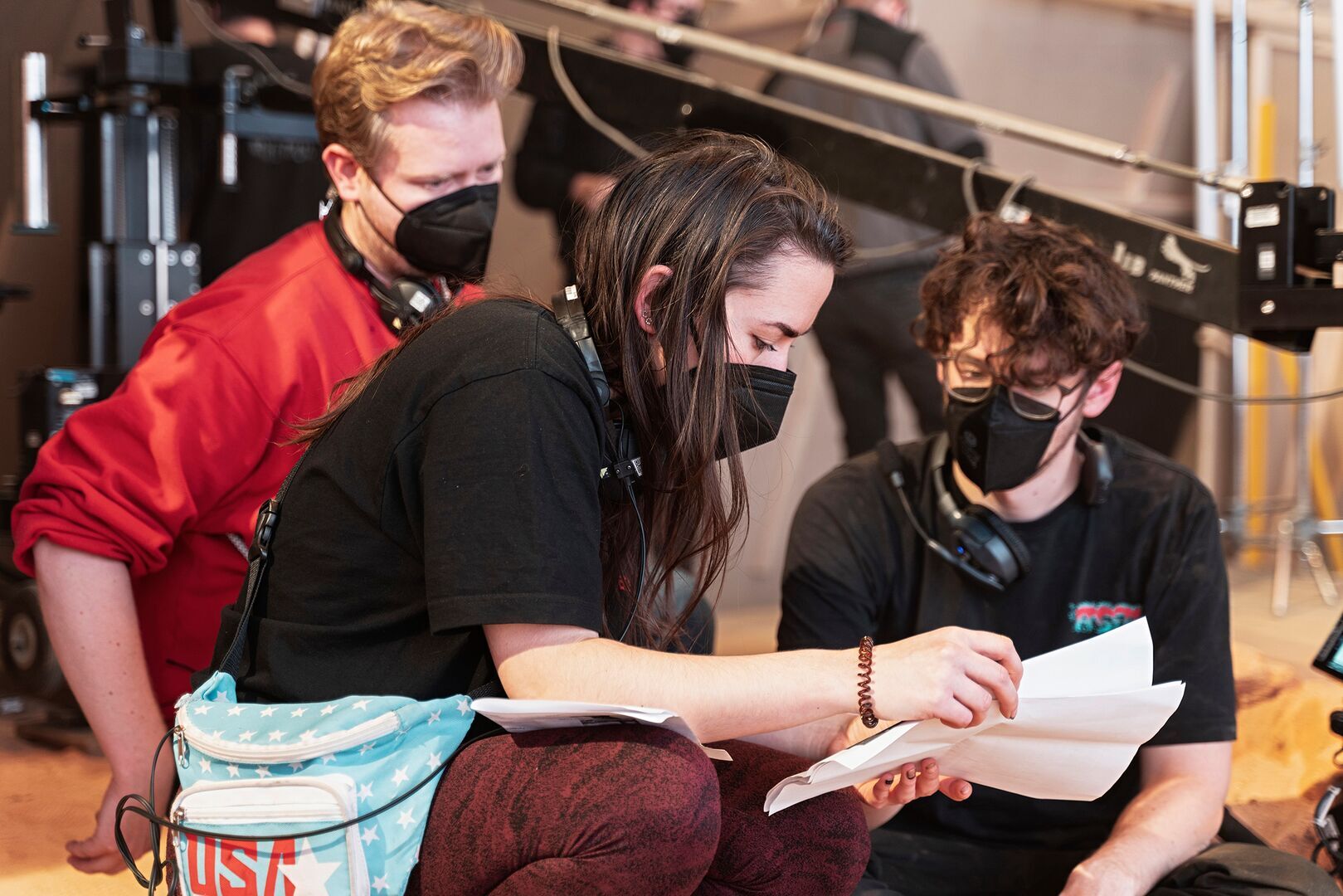 Group sits at a film set